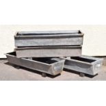 Four galvanised metal garden troughs