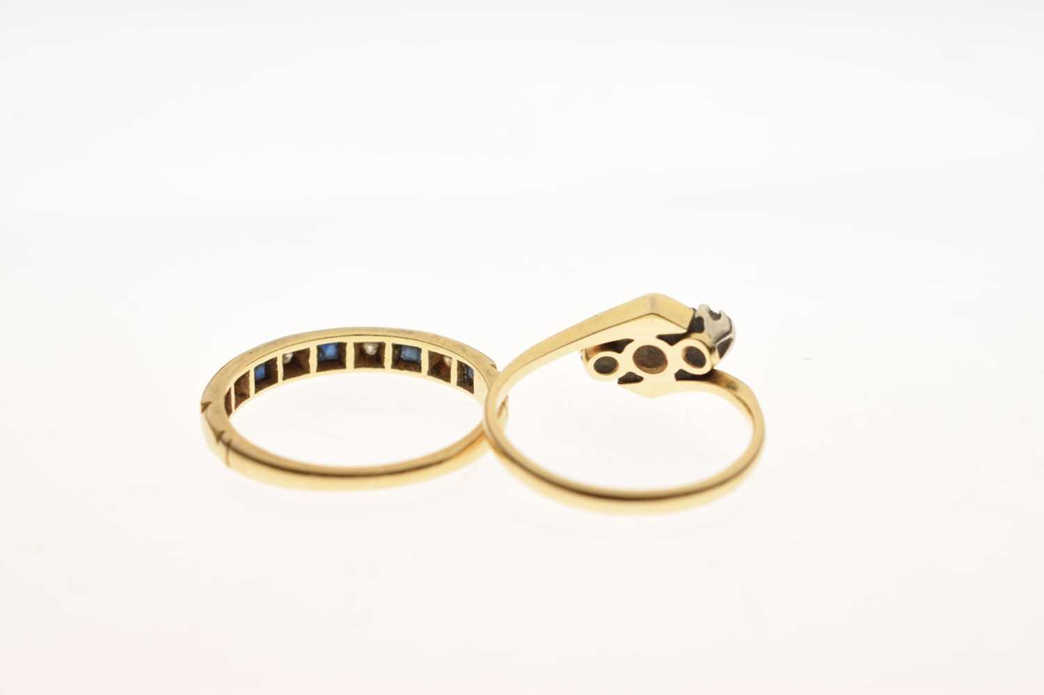 Diamond three-stone crossover ring, and a sapphire and diamond 18ct gold half eternity ring (2) - Image 4 of 6