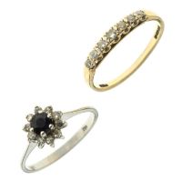 Sapphire and diamond white gold cluster ring, and a 9ct yellow gold seven-stone diamond ring