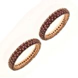 Pair of ruby pave set eternity rings