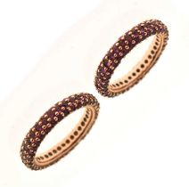 Pair of ruby pave set eternity rings