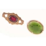 '9ct' rose gold brooch set garnet coloured faceted stone