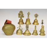 Group of eight brass hand bells, etc
