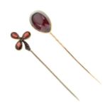 Two red stone set stick pins