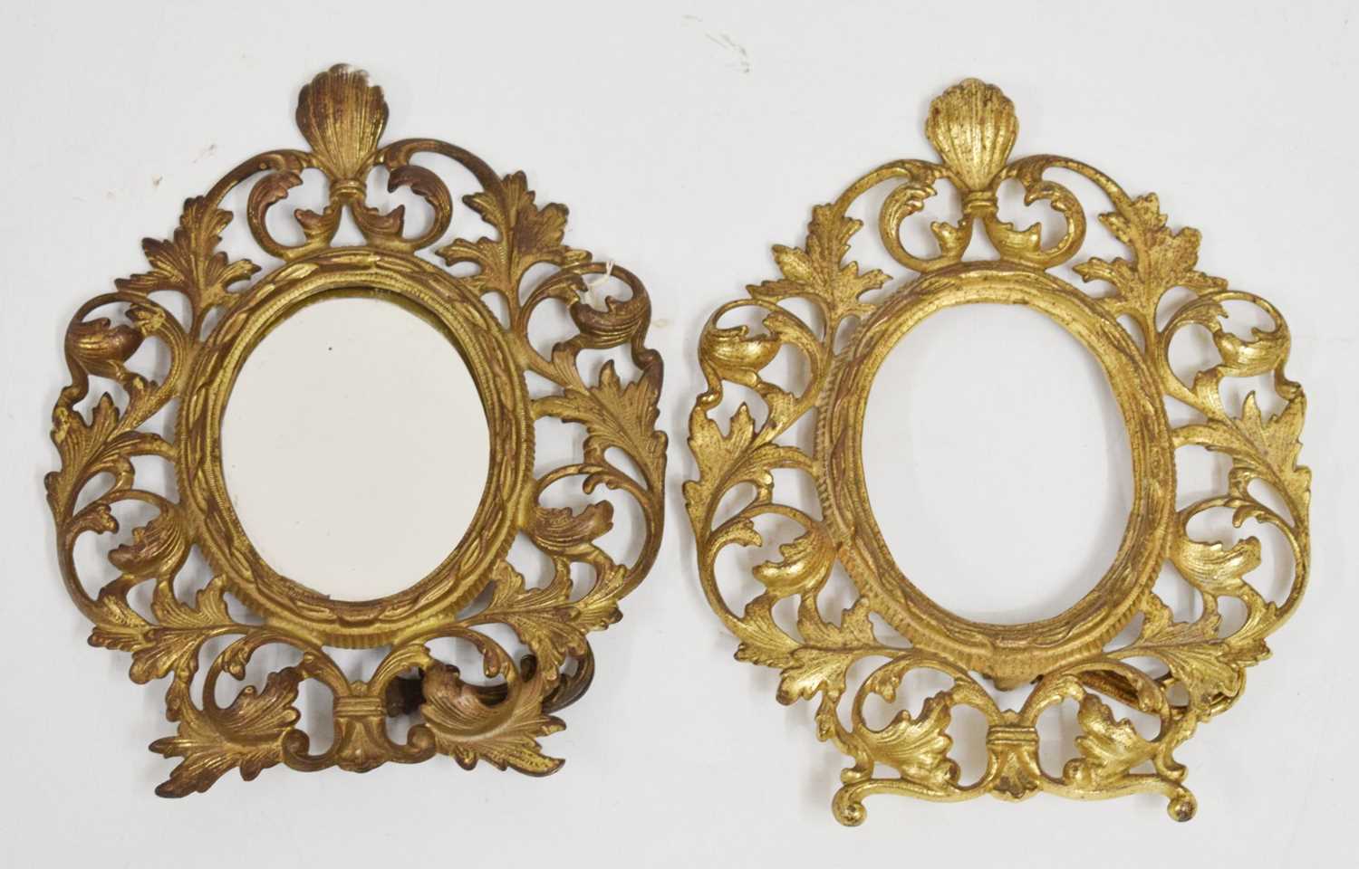 Pair of 20th century gilt cast oval frames