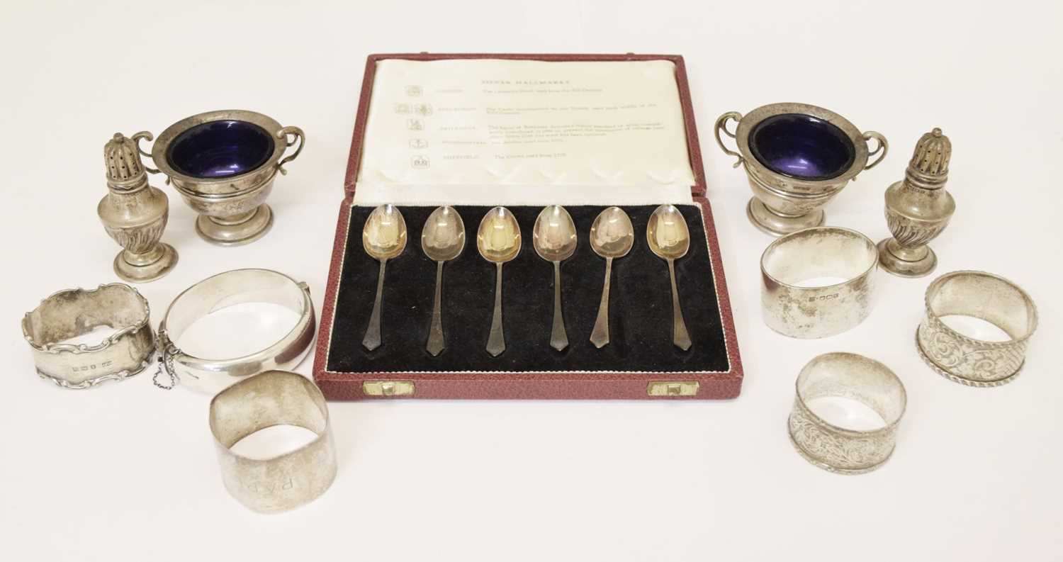 Silver teaspoons (cased), napkin rings, cruet, etc.