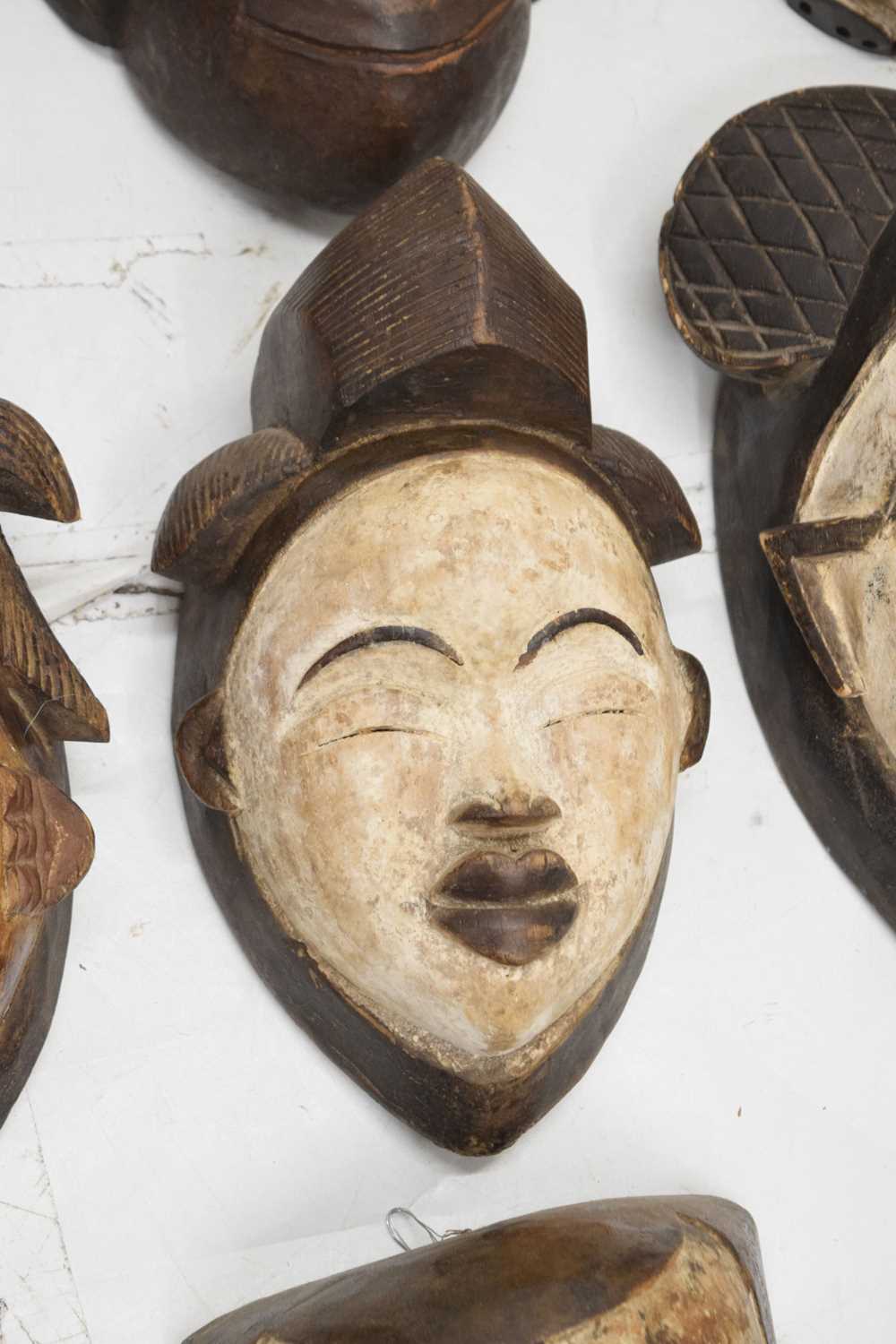 Group of ten carved wall hanging masks - Image 4 of 8