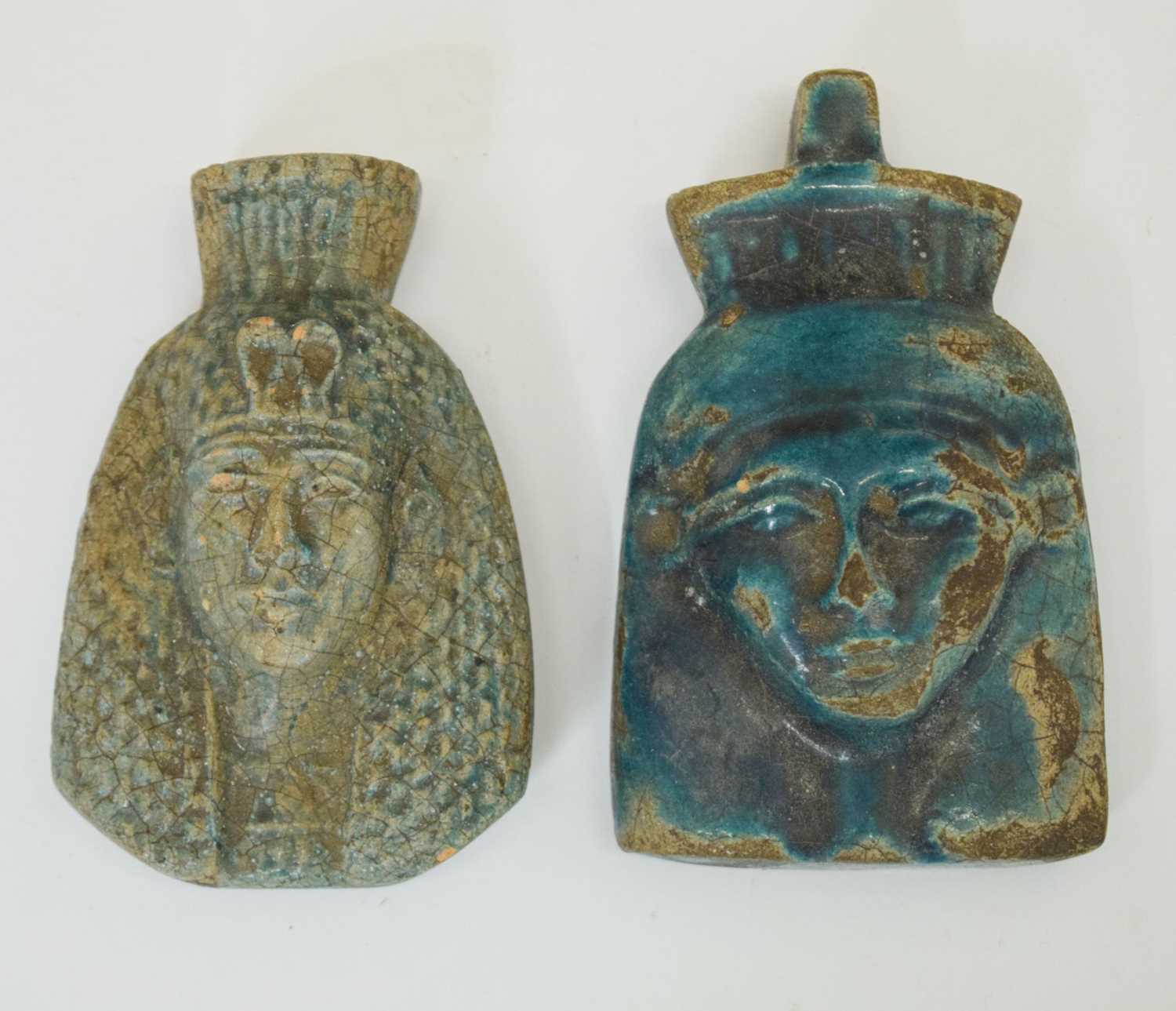 Two blue glazed faience Pharoah masks