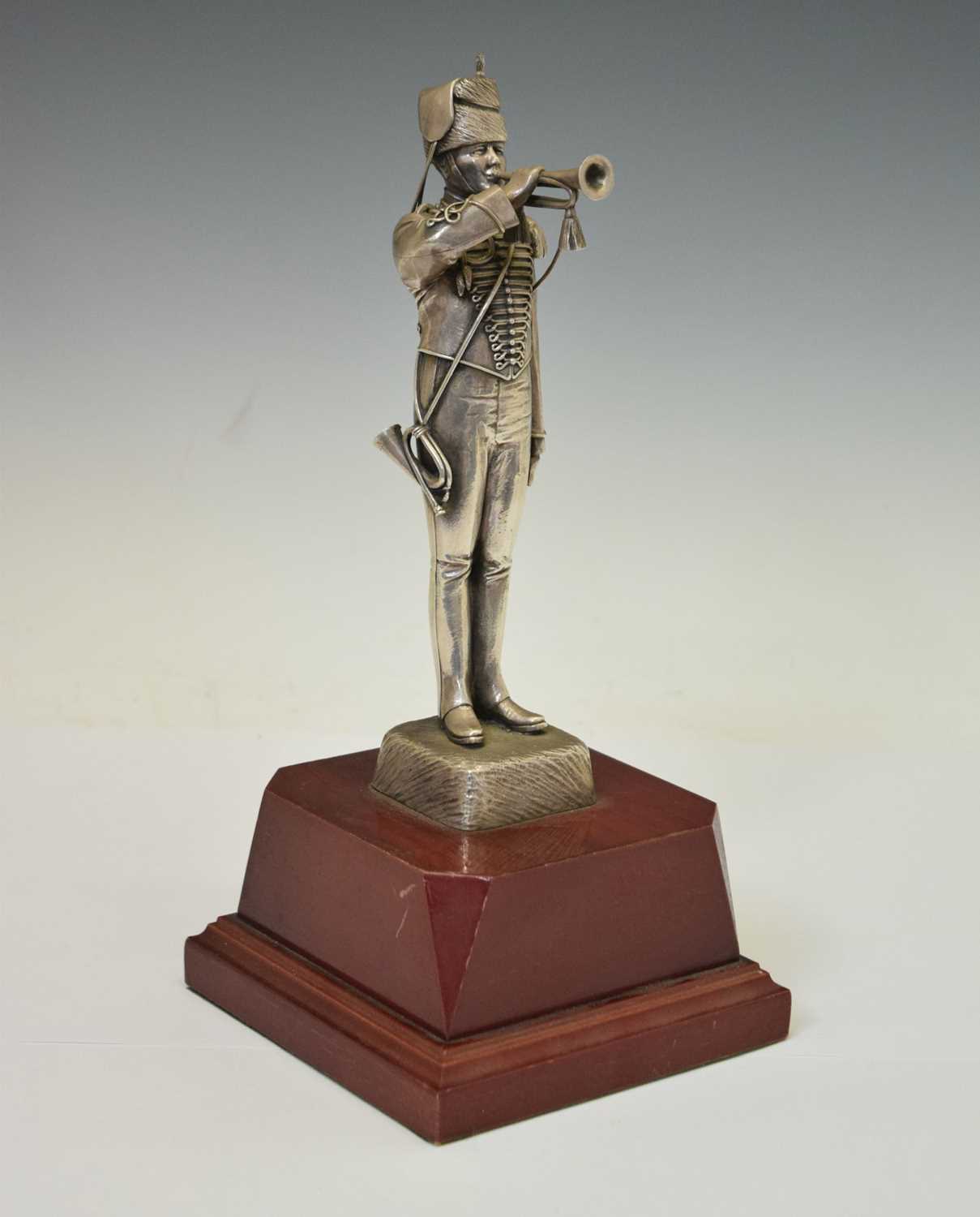 Unmarked white metal figure of a Royal Canadian Horse Artillery bugler