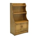 Ercol Windsor elm waterfall cupboard and shelves