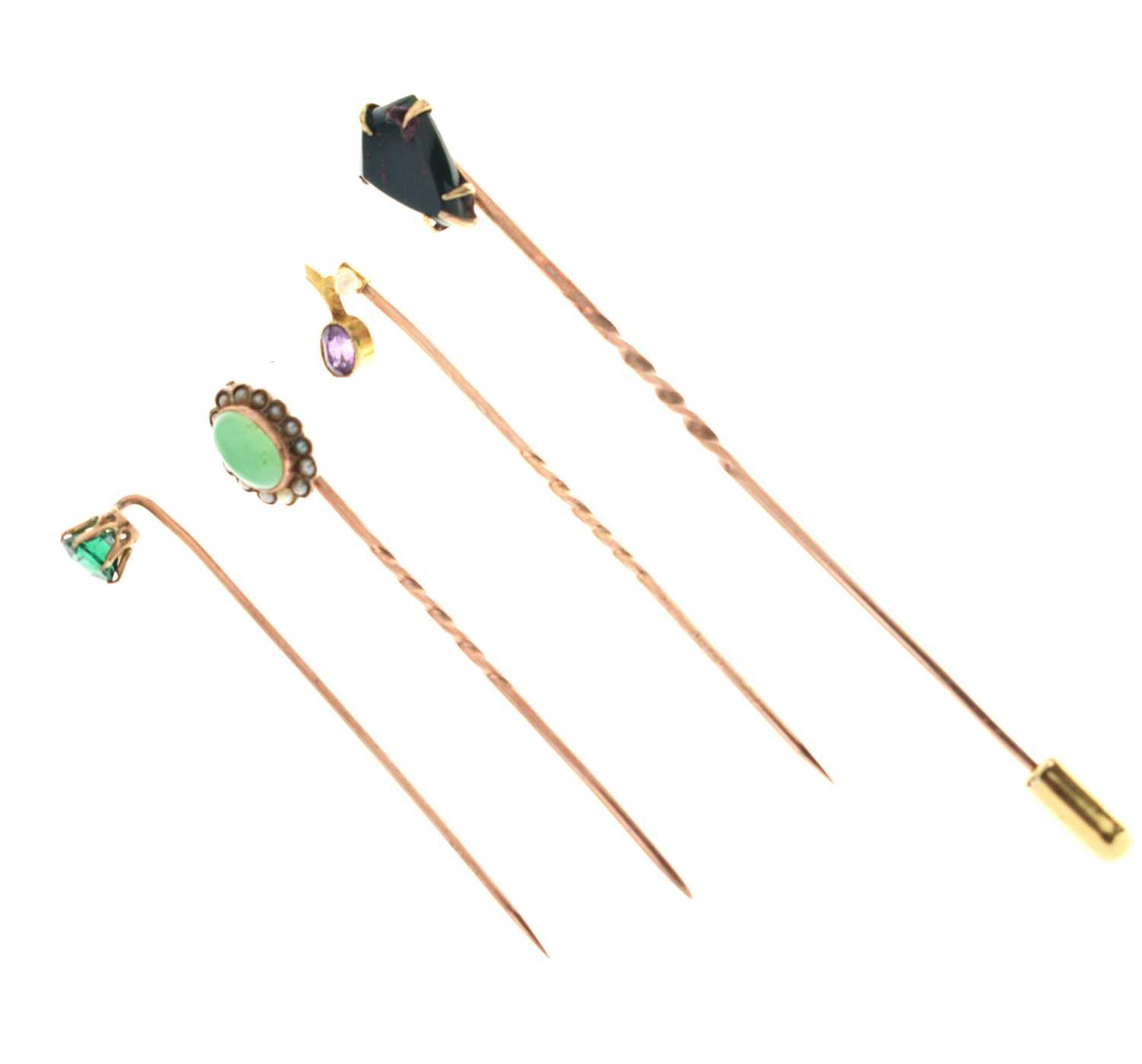 Four gem-set stick pins,