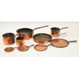 Graduated set of four copper saucepans with iron handles