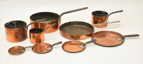 Graduated set of four copper saucepans with iron handles