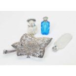 Three silver-topped perfume/scent bottles and a white-metal pierced leaf coin dish