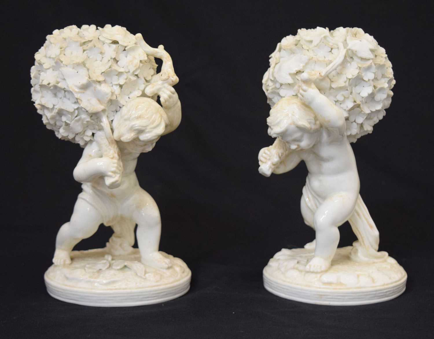 Pair of late 19th century Moore Brothers porcelain figures of cherubs