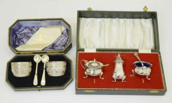 Cased pair of Victorian silver salts, and a cased Elizabeth II silver three-piece condiment set