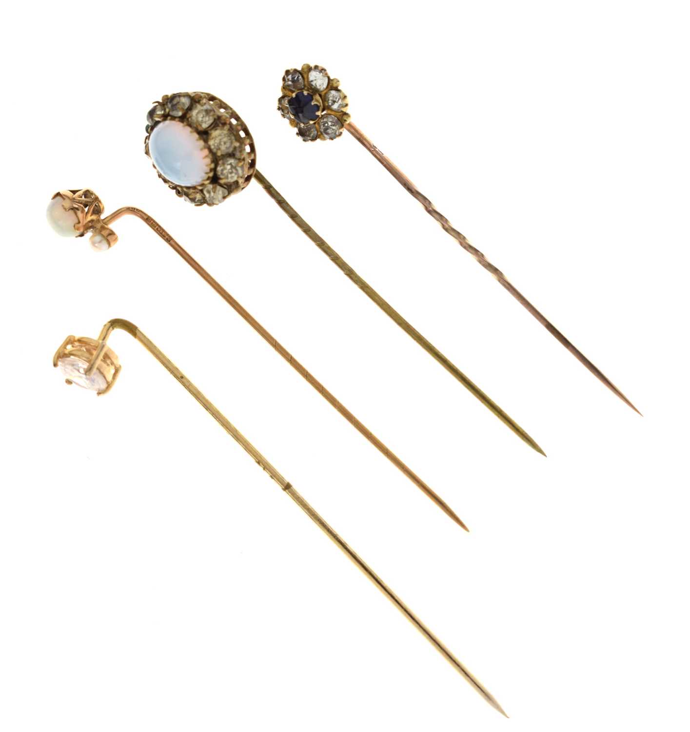 Four gem-set stick pins