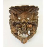 South East Asian carved wooden dragon mask