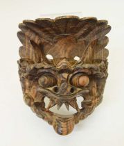 South East Asian carved wooden dragon mask