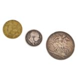 Victorian silver crown, George III shilling, and a Georgian gilt gaming counter