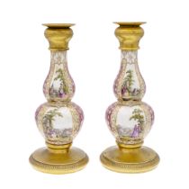 Pair of bronze and polychrome porcelain candlesticks