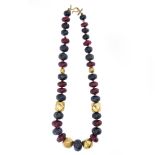 Ruby root, sapphires and 18kt yellow gold necklace