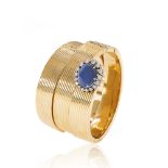 Three 18kt yellow gold with natural sapphire spiral bracelets