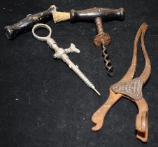 Three vintage corkscrews including a Lund patented cork drawer