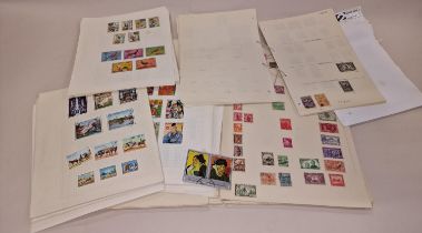 White box of album pages of world stamps used and unused.