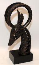 Modernist cast metal sculpture of a horned animal's head. 37cms tall including plinth