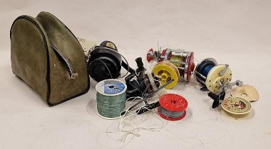 Collection of fishing reels and line.