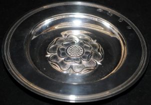 A sterling silver dish, 15cms across and featuring a Yorkshire rose to its centre, hallmarked for