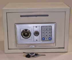 Combination electric safe with keys.