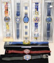 A collection of vintage Swatch Watches, many still boxed. 8 in lot