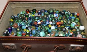 Small 41cms x 25cms briefcase containing a large quantity of vintage marbles