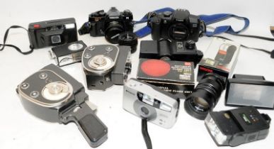 A small collection of 35mm film SLR cameras and accessories