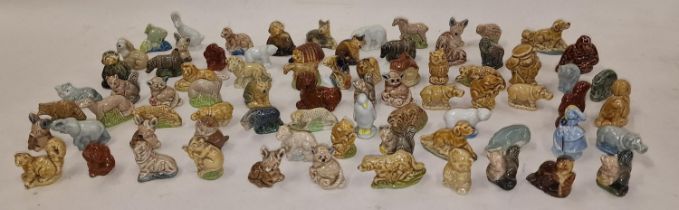A tin containing a large collection of various Wade Whimsies.
