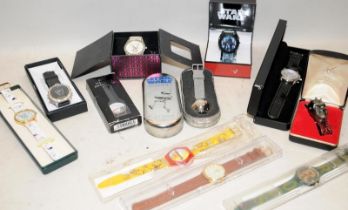 Collection of themed watches, well known brands or movie franchises including a Harrods Swatch and