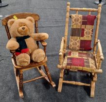 Child's vintage American style rocking chair together with another rocking chair and teddy bear.