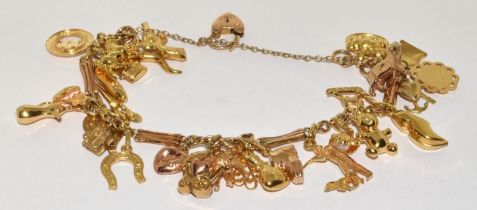 9ct gold charm bracelet together with large selection of charms 42g