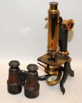 A vintage brass microscope c/w a pair of leather and brass opera glasses
