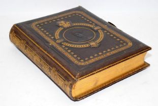 Victorian musical photograph album with gilded tooled leather boards. Good cosmetic condition. no