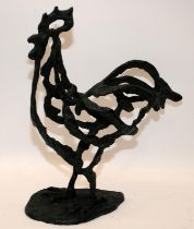 Modernist cast metal figure of a cockerel with added verdigris patination. 32cms tall