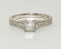 A Platinum diamond square cut centre stone and diamond shoulder ring approx 0.50 points Size M