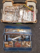 Collection of vintage tools spread amongst a box and tool box.