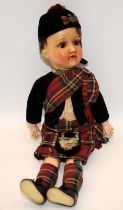 Antique Armand Marseille bisque headed doll ref: 390 dressed as a Scottish boy in Highland wear.