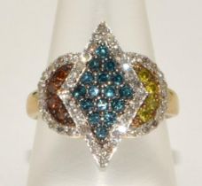 A 9ct gold ring set with blue/yellow/white and champagne diamonds Size N