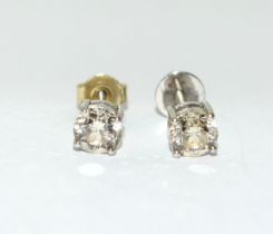 Diamond earrings approx 0.33 points in each on 18ct gold mounts.