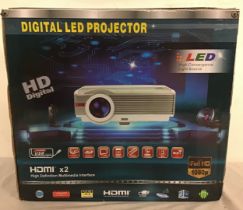 DIGITAL LED PROJECTOR. This unit comes boxed complete with remote control and powers up when plugged