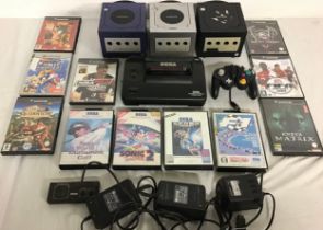 COLLECTION OF GAMECUBE AND SEGA GAMING ITEMS. Here we have 3 GameCube consoles - Sega Master